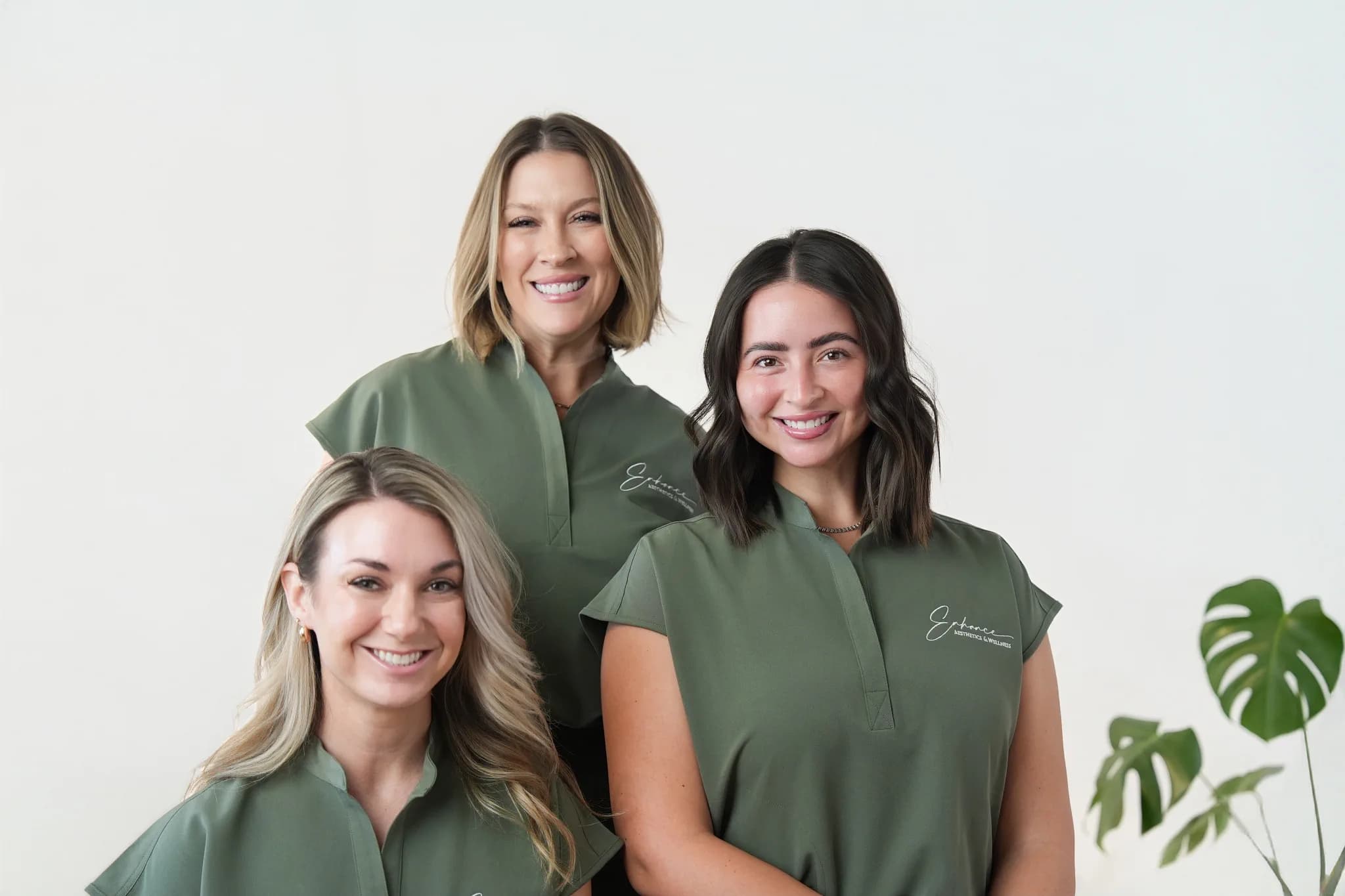 Enhance Aesthetics & Wellness team — seated portrait